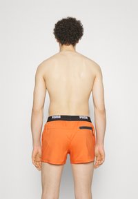 Puma SWIM MEN LOGO - Badeshorts - chili powder