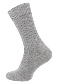 Calza grigia a coste con una morbida texture, dotata di punta e tallone rinforzati per una maggiore durata, progettata per adattarsi saldamente attorno alla caviglia.