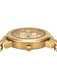 Montre-bracelet dorée avec un boîtier rond, un cadran transparent et des aiguilles en motif croisé. Dispose d'un logo MK en évidence sur la couronne et d'une finition lisse.