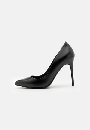 Black leather high heel pump with a pointed toe and smooth texture. Features a slim stiletto heel and a low-cut vamp design.