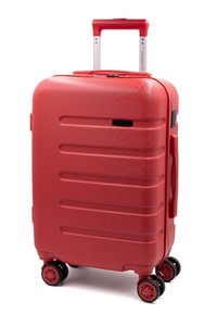 Valigia rigida rossa con superficie testurizzata, scanalature incassate, maniglia in alluminio estensibile e quattro ruote nere per la mobilità.