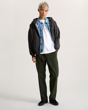 Hooded dark gray sweatshirt layered over a light blue denim jacket, white t-shirt, green pants, and black sneakers.