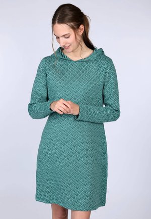 Türkisfarbenes Kleid mit Kapuze, das ein sich wiederholendes Blattmuster aufweist, lange Ärmel hat und einen lockeren Schnitt hat. Hergestellt aus weichem, strukturiertem Stoff.