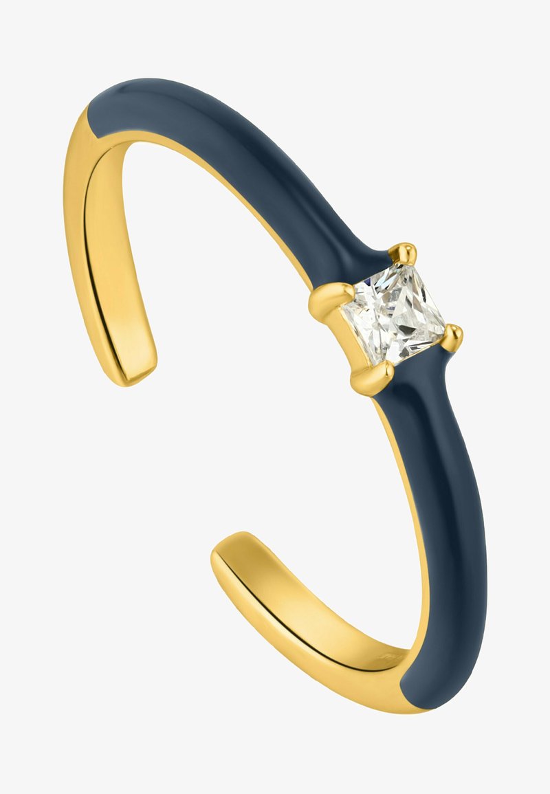 Bracciale rigido in oro con una finitura in smalto blu scuro, caratterizzato da un gemma trasparente di taglio Princess sorretta da quattro griffe in oro.