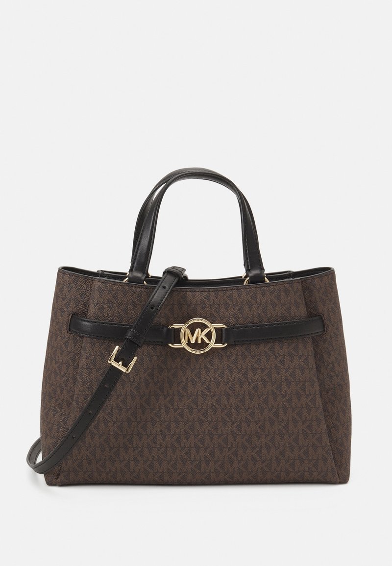 Sac à main de créateur marron avec poignées en cuir noir, bandoulière réglable et fermoir doré avec logo "MK" sur la sangle avant.