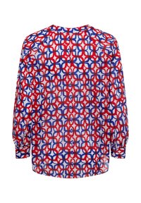 Bluse mit roten, weißen und blauen Mustern, langen Ärmeln, geometrischem Design und geknöpften Manschetten. Leicht und lässig geschnitten.