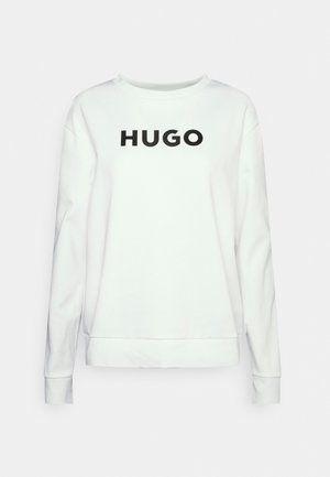 Sudadera blanca de manga larga, cuello redondo y con el logotipo negro "HUGO" en el pecho. Fabricada en suave material de algodón.