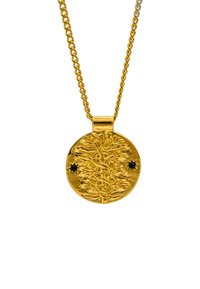 Gul hängande halsband med en detaljerad design av en gren, med två svarta stjärnaccenter, hängande från en tvinnad kedja.