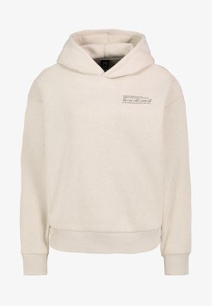 Lichtbeige hoodie gemaakt van zachte stof. Heeft een grote capuchon, ribbels aan de mouwen en onderkant, en bedrukt zwart tekst aan de voorkant.