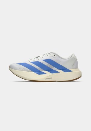 White athletic shoe with blue stripes, textured upper, flat sole, and "LIGHTSTRIKE PRO" branding on the side. Low-profile design.