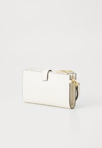 White leather wallet with a textured finish, rectangular shape, gold hardware, and a fold-over flap. Features a detachable strap and zip closure.