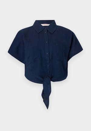 Navy blue short-sleeve shirt made of lightweight fabric, featuring a collar, button front, two chest pockets, and a knotted hem detail.