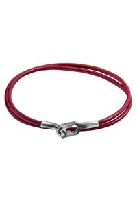 Leather bracelet with a double red cord and a silver metallic clasp shaped like a geometric link, featuring a smooth texture.