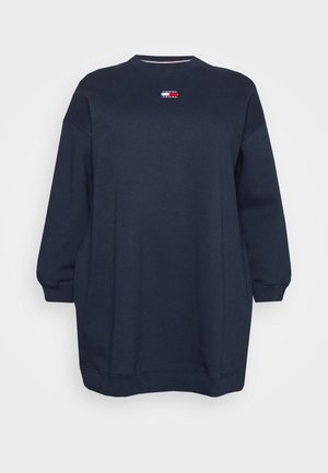 Marineblå langærmet oversized sweatshirt med ribkant ved ærmer og kant, med et lille rektangulært Tommy Jeans-logo på brystet.