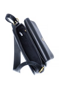 Black leather handbag with a smooth texture, flap closure, gold hardware accents, and a single adjustable strap. Interior is lined in black fabric.