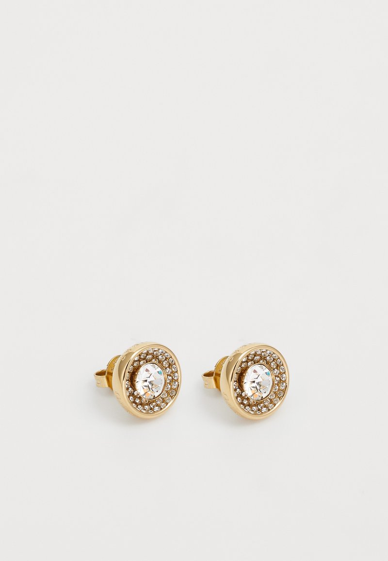 Guldøreringe med en cirkulær design, der har en central klar krystal omgivet af små krystaller i en bezelindstilling.