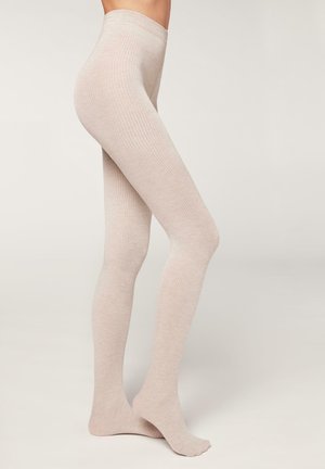 Beige gerippte Strumpfhosen aus weichem Material, mit einem hohen Taillenbund und einer glatten, gleichmäßigen Textur über das gesamte Bein.