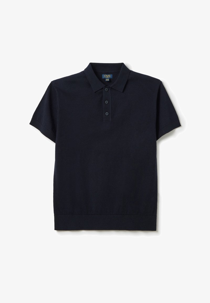 Marineblauwe polo met korte mouwen, gemaakt van zachte katoen, met een klassieke kraag, een drieknoopsluiting en een geribde zoom.