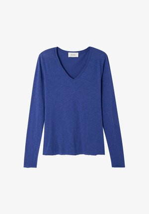 Tričko s dlhými rukávmi a výstrihom do V v jednotnej žiarivej modrej farbe. Vyrobené z mäkkej, ľahkej látky s voľným strihom a mierne zaobleným lemom.