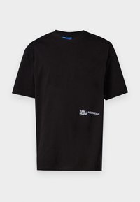 Black cotton T-shirt with short sleeves, crew neck, and white embroidered "KARL LAGERFELD JEANS" logo on the left side near the hem.