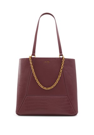 Maroon tote bag with textured surface, featuring a gold chain accent and smooth handles. Rectangular shape with contrasting patterned panels.