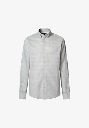 Chemise à boutons en tissu gris clair avec un motif géométrique en gris plus foncé et bleu marine. Elle présente un col, des manches longues et des boutons sur le devant.