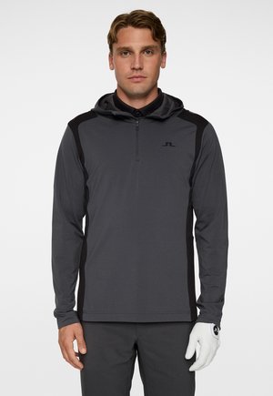 Heren hoodie in donkergrijs, met een halve rits aan de voorkant, zwarte zijpanelen en een logo op de borst. Glad, lichtgewicht materiaal.