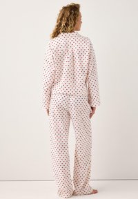 Lindex WITH LONGER LEG - Pantaloni del pigiama - red