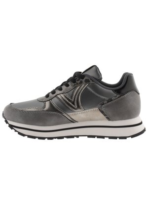 Gray athletic shoe featuring a blend of smooth and textured materials, a rounded shape, black laces, and a white midsole with black accents.