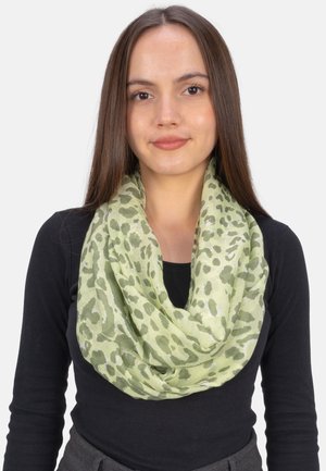 Light green infinity scarf with a leopard print pattern, made of lightweight fabric, draped around the neck for layered texture.