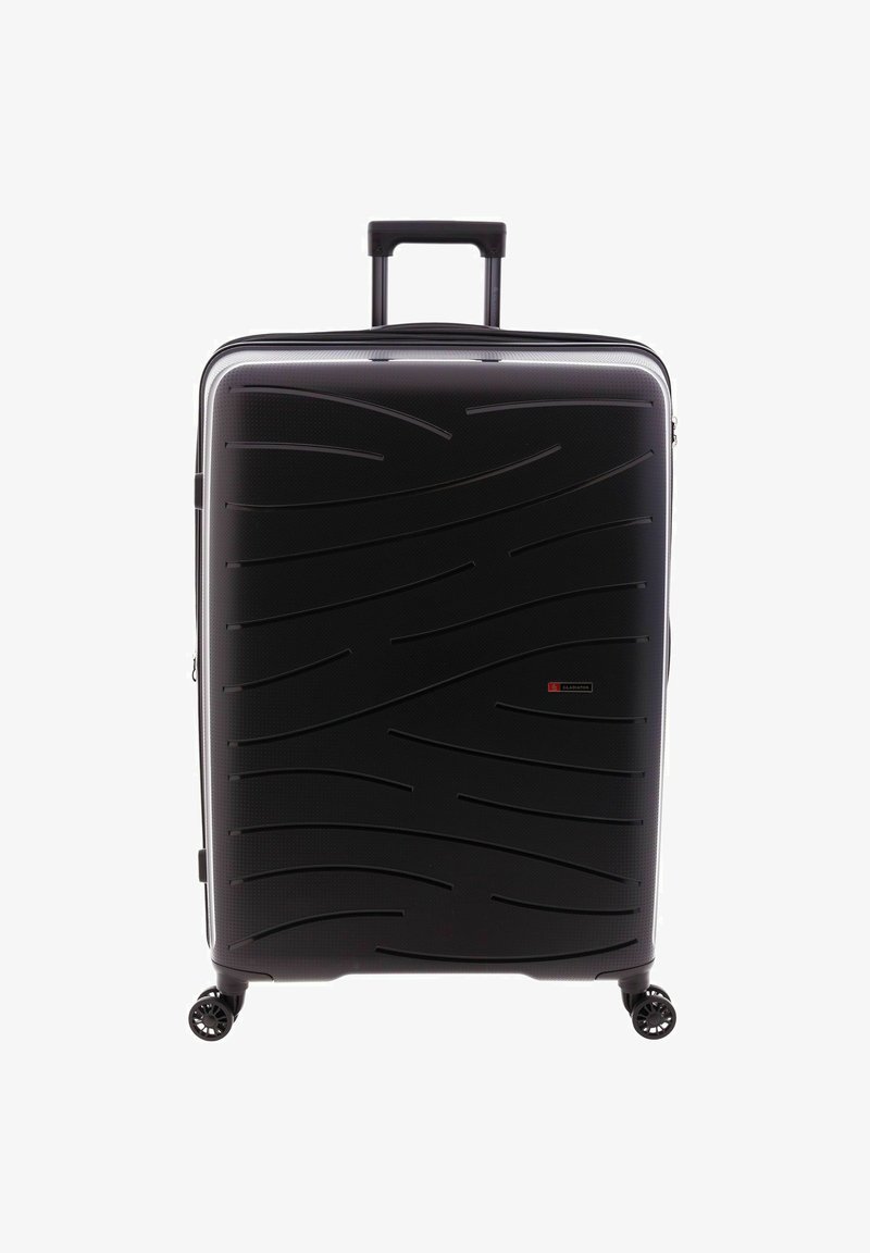 Maleta rígida negra con un patrón de olas texturizado, mango retráctil y cuatro ruedas multidireccionales para una fácil maniobrabilidad.