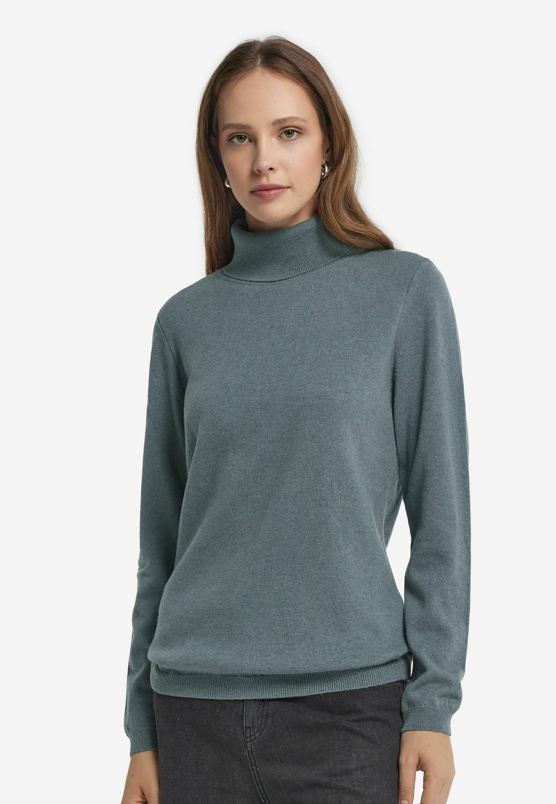 T&uuml;rkisfarbener Rollkragenpullover aus weichem Strickstoff mit langen Ärmeln und geripptem Saum. Schlichtes Design mit taillierter Silhouette und kuscheligem Tragegefühl.