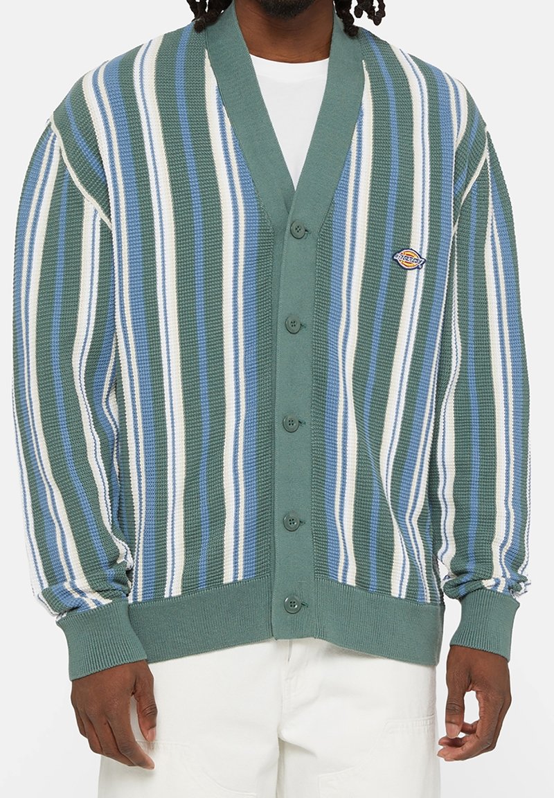Green and blue striped cardigan with a V-neck, button closure, and knit texture. Features a chest logo and ribbed cuffs and hem.