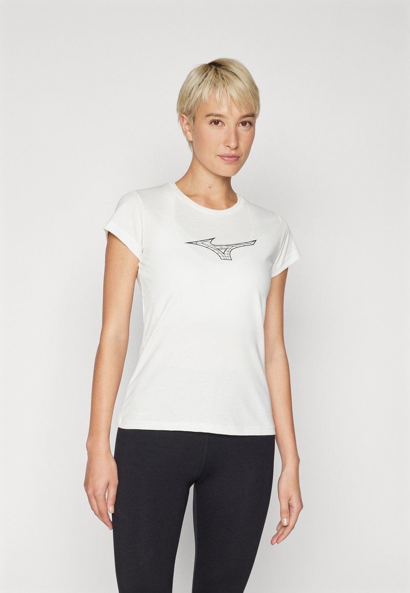 White cotton t-shirt with short sleeves and a round neckline. Features a black, abstract logo on the chest. Paired with black leggings.