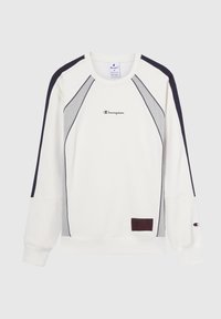 Bluzą crewneck w kolorze ecru z granatowymi i szarymi akcentami. Posiada logo z przodu oraz naszywkę na dole. Wykonana z miękkiego materiału bawełnianego.