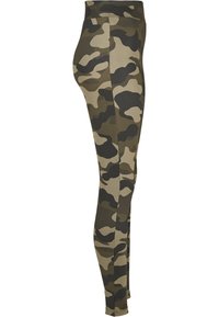 Kamouflageleggings i olika nyanser av grönt och brunt, med en åtsittande design, mjukt tyg och hög midja.