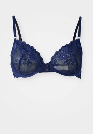 Soutien-gorge en dentelle bleu marine avec motifs floraux, design à trois parties pour les bonnets, bretelles réglables et fermeture à crochets au dos.