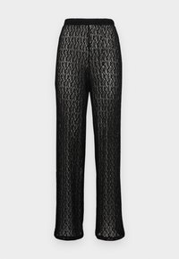 Czarne spodnie wykonane z przejrzystej, teksturowanej koronki z diamentowym wzorem i elastycznym pasem. Rozkloszowane nogawki o długości do kostek.