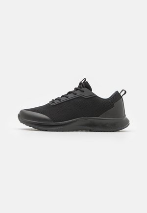 Baskets de sport noires avec une tige en mailles et des accents texturés, une semelle en caoutchouc lisse et un design à lacets pour un maintien sûr.