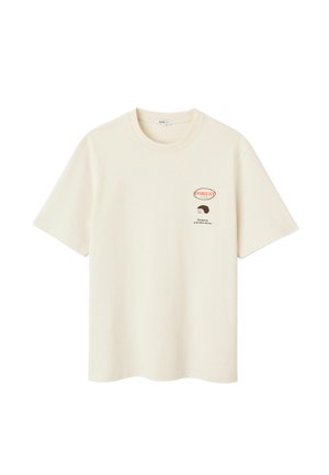 T-shirt en coton crème avec manches courtes, col rond et un motif imprimé d'un hérisson avec le texte "FORÊT !" sur la poitrine.