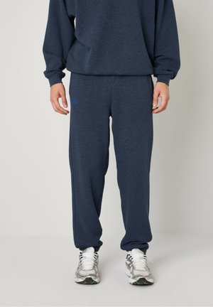 JOGGING DOVEN - Tracksuit bottoms - marine surteint