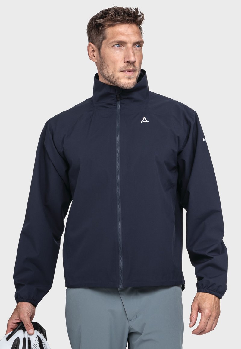 Marineblaue wasserdichte Jacke mit hohem Kragen, Reißverschluss vorne, elastischen Bündchen und Logodetail auf der Brust. Leichtes Design, das sich für den Einsatz im Freien eignet.