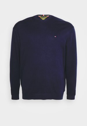 Marineblauw ronde hals trui gemaakt van zachte stof met lange mouwen en geribbelde manchetten. Heeft een klein logo op de borst.