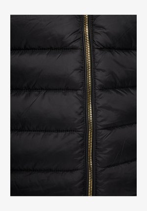 Black puffer vest with quilted panels, featuring a gold-tone zipper in the center. Smooth, shiny fabric with a lightweight texture.