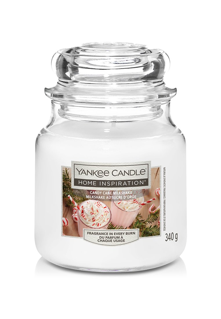 Candela Yankee in un vaso di vetro trasparente con coperchio rotondo. L'etichetta presenta un design di un frullato in colori pastello. Peso 340 g.