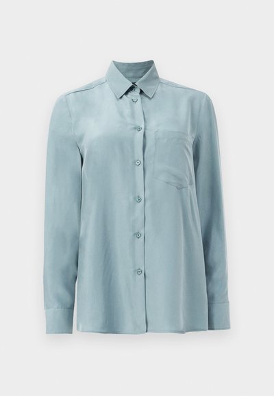 Light blue long-sleeve shirt made of smooth fabric, featuring a button front, collar, and a single chest pocket.