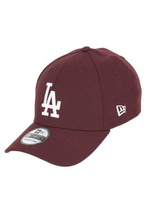 Maroon baseball cap made from durable fabric, featuring a white "LA" logo on the front, a curved visor, and vent holes for breathability.