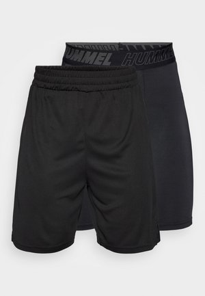 Czarne sportowe szorty z elastycznym pasem. Jedna para jest luźna i ma matową fakturę, druga jest dopasowana i ma gładkie wykończenie.