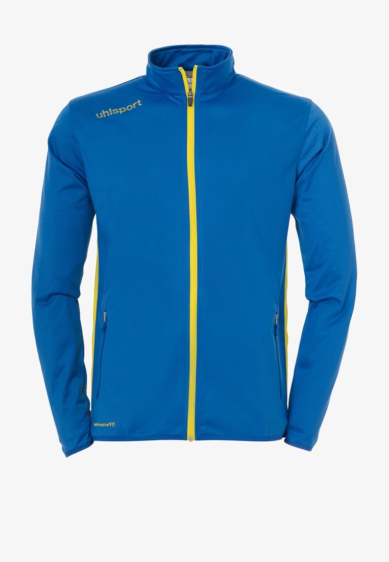 Blaue Jacke mit hohem Kragen, durchgehendem gelben Reißverschluss, Seitentaschen und gelbem Markenlogo auf der linken Brust. Glatte Textur.