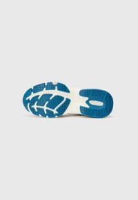 Blue rubber outsole with traction patterns, white midsole, and a smooth rounded toe. Features logos and textured detailing for grip.